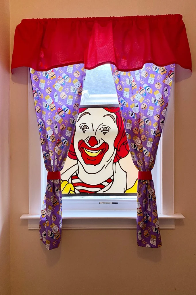 Taylor Gecking’s fast-food themed restaurant includes a Ronald McDonald stained-glass window.

